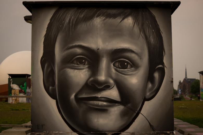 a street art picture of a boyish child