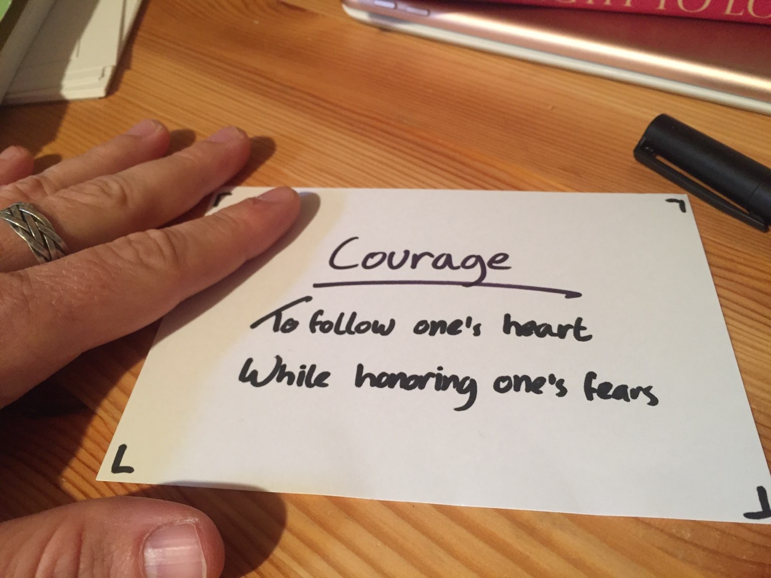 A sign that reads: Courage to follow one's heart while honoring one's fears